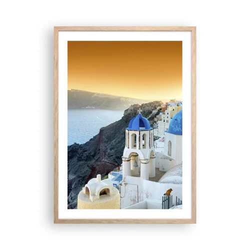 Een poster in een licht eiken lijst - Santorini - genesteld tegen de rotsen - 50x70 cm