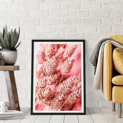 Poster in een zwarte lijst - Een bloemencascade in roze - 50x70 cm