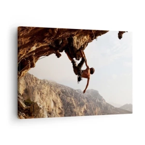 Schilderen op canvas - Een klimmer op een steile klif in de bergen in de zon - 70x50cm - De wereld gekrompen in een hand op een rotsblok  - Moderne wanddecoratie voor woonkamer en slaapkamer ARTTOR