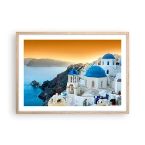 Een poster in een licht eiken lijst - Santorini - genesteld tegen de rotsen - 70x50 cm