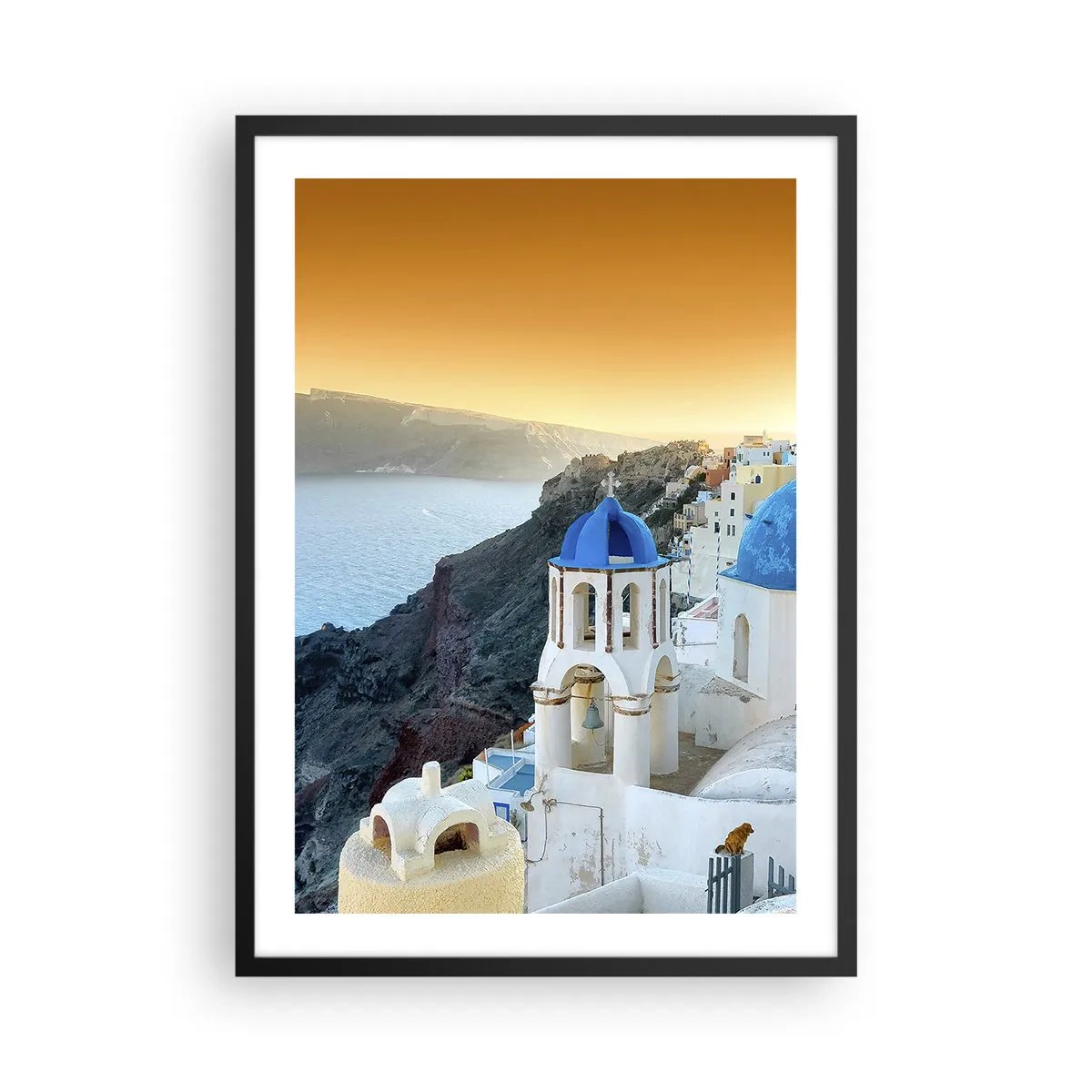 Poster in een zwarte lijst - Santorini met zijn witte huizen en blauwe koepels - 50x70cm - Santorini - genesteld tegen de rotsen - Moderne wanddecoratie voor woonkamer en slaapkamer ARTTOR