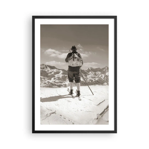 Poster in een zwarte lijst - Een skiër in retrostijl met bergen op de achtergrond - 50x70cm - En de bergen blijven onveranderd - Moderne wanddecoratie voor woonkamer en slaapkamer ARTTOR