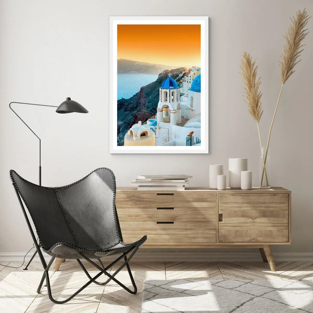 Poster in een witte lijst - Santorini - genesteld tegen de rotsen - 40x50 cm