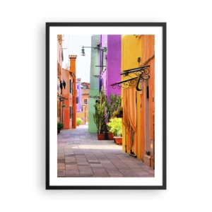Poster in een zwarte lijst - Een kleurrijke straat met planten en levendige gevels - 50x70cm - Regenboogsteeg - Moderne wanddecoratie voor woonkamer en slaapkamer ARTTOR