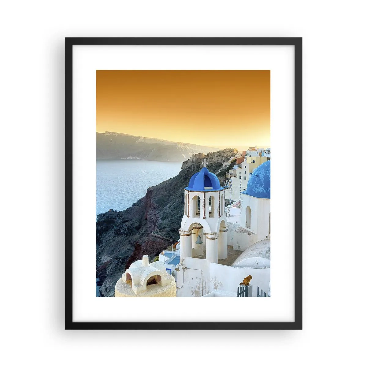 Poster in een zwarte lijst - Santorini - genesteld tegen de rotsen - 40x50 cm