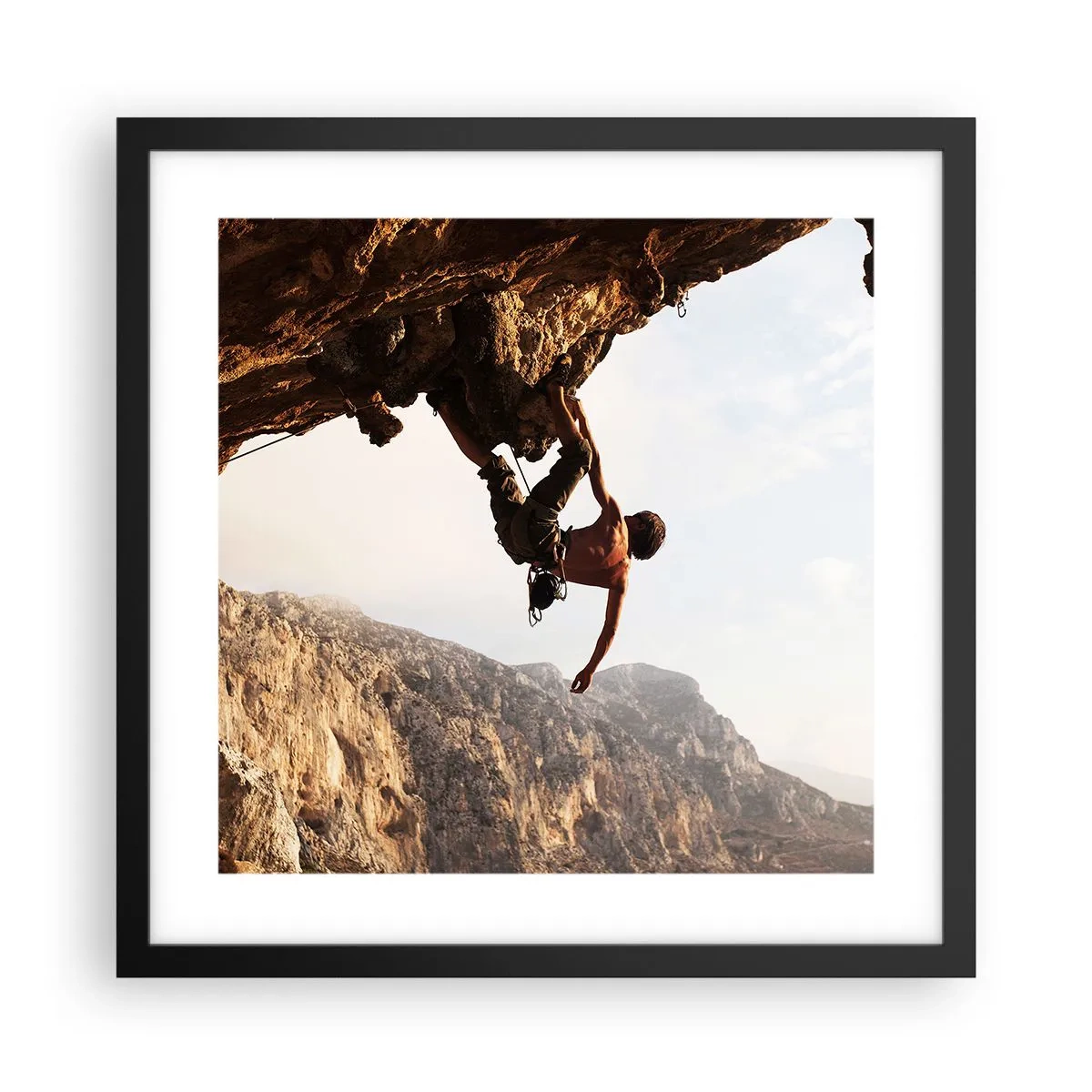 Poster in een zwarte lijst - De wereld gekrompen in een hand op een rotsblok - 40x40 cm