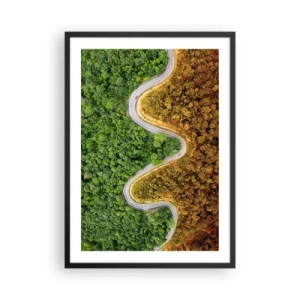 Poster in een zwarte lijst - Een weg die door een bos slingert, verdeeld in groene en herfstachtige delen - 50x70cm - Grenzen en doorbraken - Moderne wanddecoratie voor woonkamer en slaapkamer ARTTOR