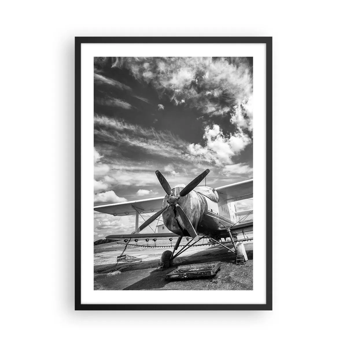 Poster in een zwarte lijst - Zwart-witfoto van een retrovliegtuig tegen de lucht - 50x70cm - Ik kan niet wachten! - Moderne wanddecoratie voor woonkamer en slaapkamer ARTTOR