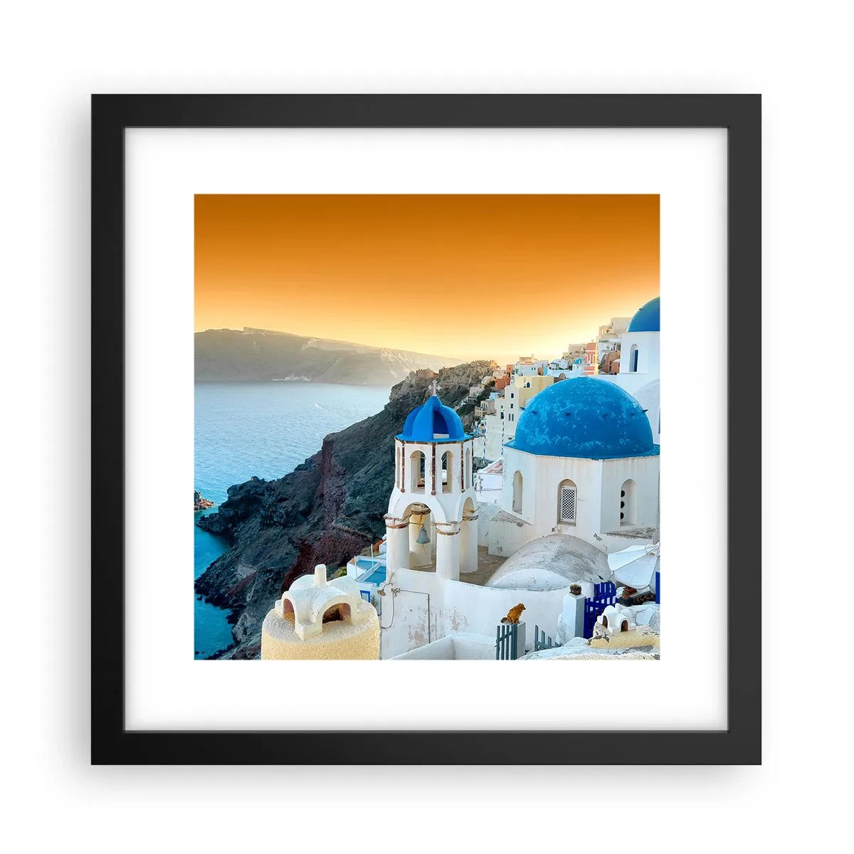 Poster in een zwarte lijst - Santorini - genesteld tegen de rotsen - 30x30 cm