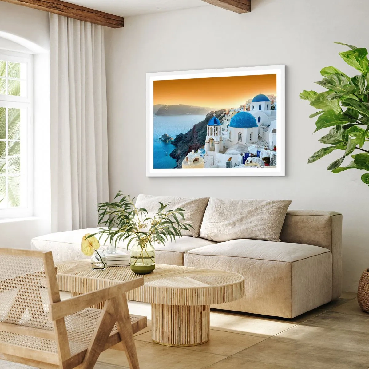 Poster in een witte lijst - Santorini - genesteld tegen de rotsen - 100x70 cm