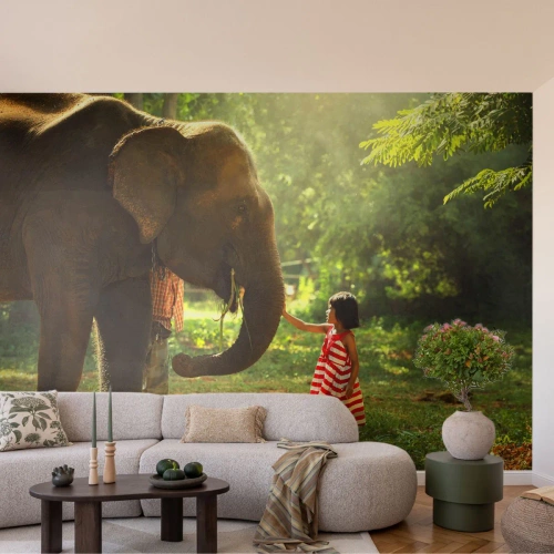 Fotobehang Premium Canvas - De kracht van vriendschap - Dieren, Olifant, Meisje - 100x70 cm