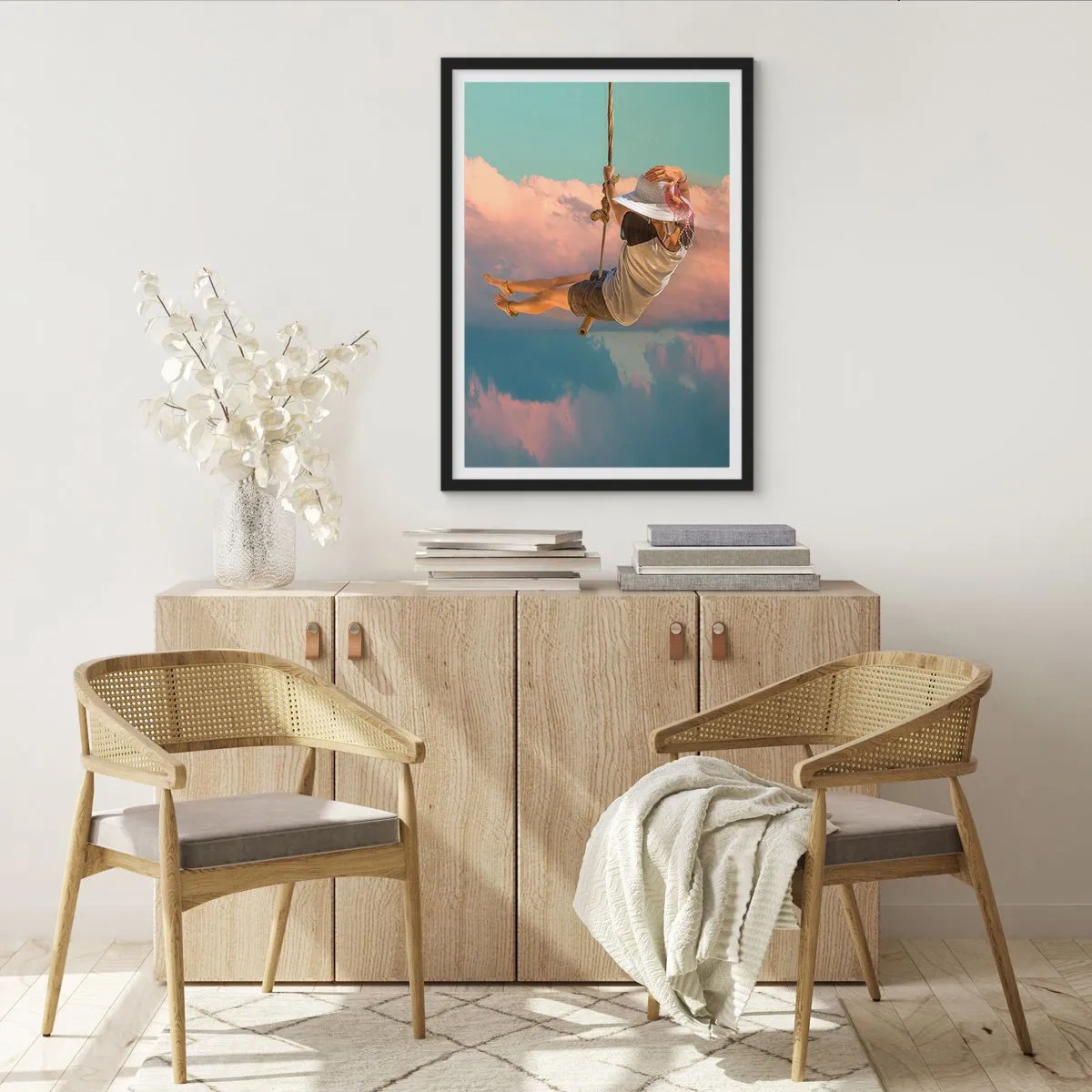 Poster in een zwarte lijst - Een vrouw op een schommel tussen pastelkleurige wolken - 50x70cm - Plezier in de wolken - Moderne wanddecoratie voor woonkamer en slaapkamer ARTTOR
