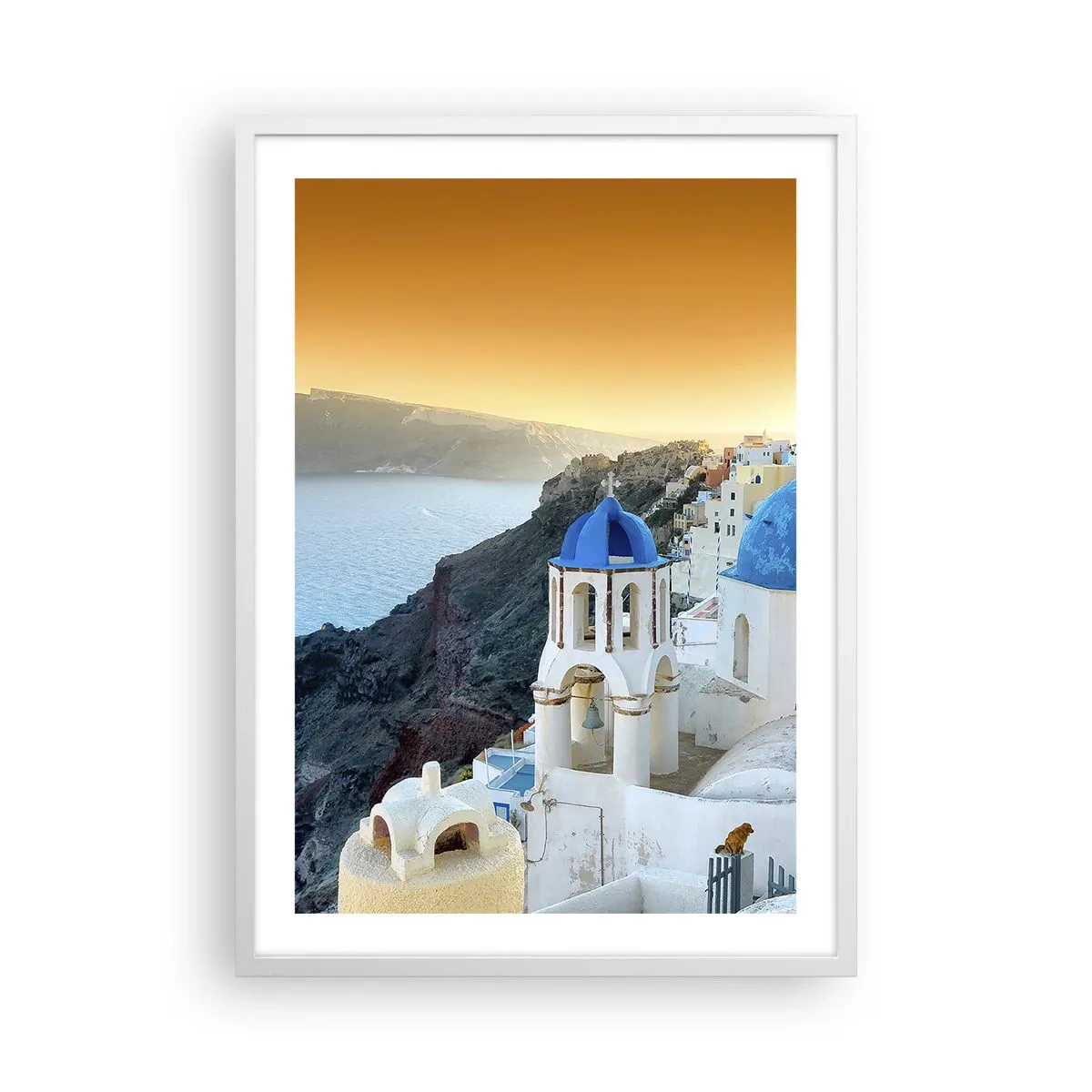 Poster in een witte lijst - Santorini - genesteld tegen de rotsen - 50x70 cm